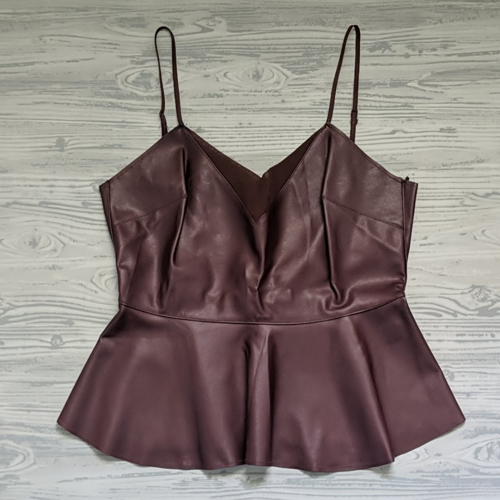 Sleeveless faux leather peplum top by Forever21